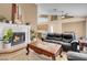 Living room featuring a fireplace, neutral tones, and open floorplan at 5033 Austrian Dr, Las Vegas, NV 89130