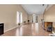 Spacious living room with hardwood floors, vaulted ceilings, and modern light fixture at 5033 Austrian Dr, Las Vegas, NV 89130