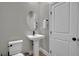 Powder room with pedestal sink and toilet at 530 Sonoma Range St, Las Vegas, NV 89138