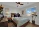 Comfortable bedroom with wooden floors and natural light from window with blinds at 530 Sonoma Range St, Las Vegas, NV 89138
