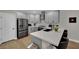 Open kitchen features stainless appliances, a breakfast bar, and sleek cabinetry at 530 Sonoma Range St, Las Vegas, NV 89138
