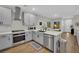 Bright kitchen with stainless appliances, light countertops, and eat-in area at 530 Sonoma Range St, Las Vegas, NV 89138