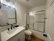 Modern bathroom features new vanity, fixtures, and a shower-tub combo at 5600 Nimes Ave, Las Vegas, NV 89141