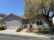 Charming single-story home features a well-maintained front yard and a two-car garage at 5600 Nimes Ave, Las Vegas, NV 89141