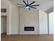 Bright living room features a modern fireplace and lots of light at 5600 Nimes Ave, Las Vegas, NV 89141