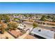 Aerial view showcasing neighborhood homes with city skyline views in the background at 5800 Auborn Ave, Las Vegas, NV 89108