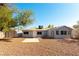 View of the home's backyard with gravel landscaping and a storage shed at 5800 Auborn Ave, Las Vegas, NV 89108