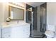 Modern bathroom featuring quartz counters, updated tiling, and a glass enclosed shower at 5800 Auborn Ave, Las Vegas, NV 89108
