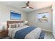 Comfortable bedroom with a serene atmosphere, complemented by a stylish ceiling fan and artwork at 5800 Auborn Ave, Las Vegas, NV 89108