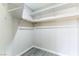 Walk-in closet with built-in shelving and a wooden clothes rod for optimal organization at 5800 Auborn Ave, Las Vegas, NV 89108