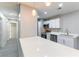 Bright and modern kitchen with white cabinets, stainless steel appliances, and ample counter space at 5800 Auborn Ave, Las Vegas, NV 89108