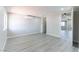 Bright living room featuring new gray wood-look flooring and an efficient mini-split air conditioning system at 5800 Auborn Ave, Las Vegas, NV 89108