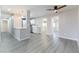 Open-concept living area with gray plank flooring and views of the kitchen and dining area at 5800 Auborn Ave, Las Vegas, NV 89108