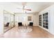 Additional living room area with wood flooring and a double door for natural light and access to backyard at 5809 Pebble Beach Blvd, Las Vegas, NV 89108
