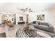 Bright living room boasts a ceiling fan, neutral paint, and an open floor plan for easy entertaining at 5809 Pebble Beach Blvd, Las Vegas, NV 89108
