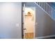 Attic storage space with shelving for storage and finished floors and baseboards at 6293 Pavestone Ln, Las Vegas, NV 89142