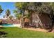 A beautiful backyard with a lush lawn and a swimming pool, perfect for outdoor entertaining at 6293 Pavestone Ln, Las Vegas, NV 89142