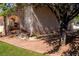 Backyard view showcases a covered patio, outdoor dining, and mature landscaping at 6293 Pavestone Ln, Las Vegas, NV 89142