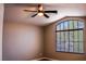 Bedroom features neutral walls and a large arch window with natural lighting at 6293 Pavestone Ln, Las Vegas, NV 89142