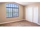 Bedroom features a closet with sliding doors and a bright window with blinds at 6293 Pavestone Ln, Las Vegas, NV 89142