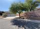 Charming home with a three-car garage and mature landscaping in a quiet residential neighborhood at 6293 Pavestone Ln, Las Vegas, NV 89142