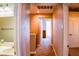 Upstairs hallway showing a bathroom and bedroom, carpeted floor at 6293 Pavestone Ln, Las Vegas, NV 89142