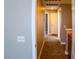A clean and well-maintained carpeted hallway that leads to other rooms at 6293 Pavestone Ln, Las Vegas, NV 89142