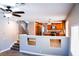 Bright kitchen featuring wooden cabinets, stainless steel appliances, and ample counter space at 6293 Pavestone Ln, Las Vegas, NV 89142