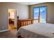 Main bedroom featuring a dresser, sliding glass door to patio, and ensuite bathroom at 6293 Pavestone Ln, Las Vegas, NV 89142