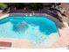 Sparkling pool with cool blue water, an automatic cleaner, stepping stones, and backyard seating at 6293 Pavestone Ln, Las Vegas, NV 89142