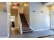 Carpeted staircase with white railings leads to the upper level, adding architectural detail at 6293 Pavestone Ln, Las Vegas, NV 89142