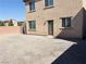 Gravel backyard features a blank canvas for your outdoor oasis, with block wall and rear entrance at 664 Forest Peak St, Henderson, NV 89011