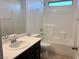 This bright bathroom features a shower-tub combination with tile surround, along with a modern vanity at 664 Forest Peak St, Henderson, NV 89011