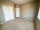 Spacious bedroom with neutral paint, carpet, and dual closets, offering a serene and inviting retreat at 664 Forest Peak St, Henderson, NV 89011