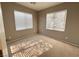 Bedroom featuring carpet flooring, a neutral color palette, and two windows offering natural light at 664 Forest Peak St, Henderson, NV 89011
