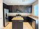 A chef's dream; this kitchen boasts stainless steel appliances, granite countertops, and hardwood floors at 664 Forest Peak St, Henderson, NV 89011
