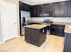 A chef's dream; this kitchen boasts stainless steel appliances, granite countertops, and hardwood floors at 664 Forest Peak St, Henderson, NV 89011