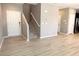 A spacious living area flows seamlessly to an open stairwell providing an open area for relaxation and gatherings at 664 Forest Peak St, Henderson, NV 89011