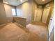 Open loft area offering versatility with neutral paint and carpet, and adjacent to multiple bedrooms at 664 Forest Peak St, Henderson, NV 89011