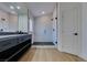 Sleek bathroom with a glass-enclosed tiled shower and dark vanity at 7132 Mission Hills Dr, Las Vegas, NV 89113