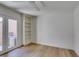 Bright room with built-in shelving, ceiling fan, and private access to the backyard at 7132 Mission Hills Dr, Las Vegas, NV 89113