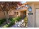 Charming exterior view showcasing the home's entrance with desert landscaping and a private courtyard at 7132 Mission Hills Dr, Las Vegas, NV 89113