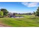 Scenic view of the golf course and pond with lush green grass at 7132 Mission Hills Dr, Las Vegas, NV 89113