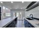 Open kitchen design with center island, connecting seamlessly to the outdoor living area at 7132 Mission Hills Dr, Las Vegas, NV 89113