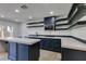Updated kitchen featuring a center island, modern appliances, and contemporary finishes at 7132 Mission Hills Dr, Las Vegas, NV 89113