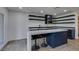 Modern kitchen featuring sleek countertops, a center island with seating, and stylish open shelving at 7132 Mission Hills Dr, Las Vegas, NV 89113