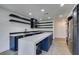 Contemporary kitchen with an island, stainless steel appliances, and open shelving at 7132 Mission Hills Dr, Las Vegas, NV 89113