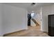 Spacious room with views of the stairs, natural light and new flooring at 7132 Mission Hills Dr, Las Vegas, NV 89113