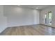 Bright living area features new floors, neutral paint, recessed lighting and views of the backyard at 7132 Mission Hills Dr, Las Vegas, NV 89113