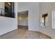 Bright living room showcasing wood floors, high ceilings, and an open floor plan at 7132 Mission Hills Dr, Las Vegas, NV 89113